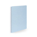 Blue spiral notebook with dotted cover design on white background. (Sky)